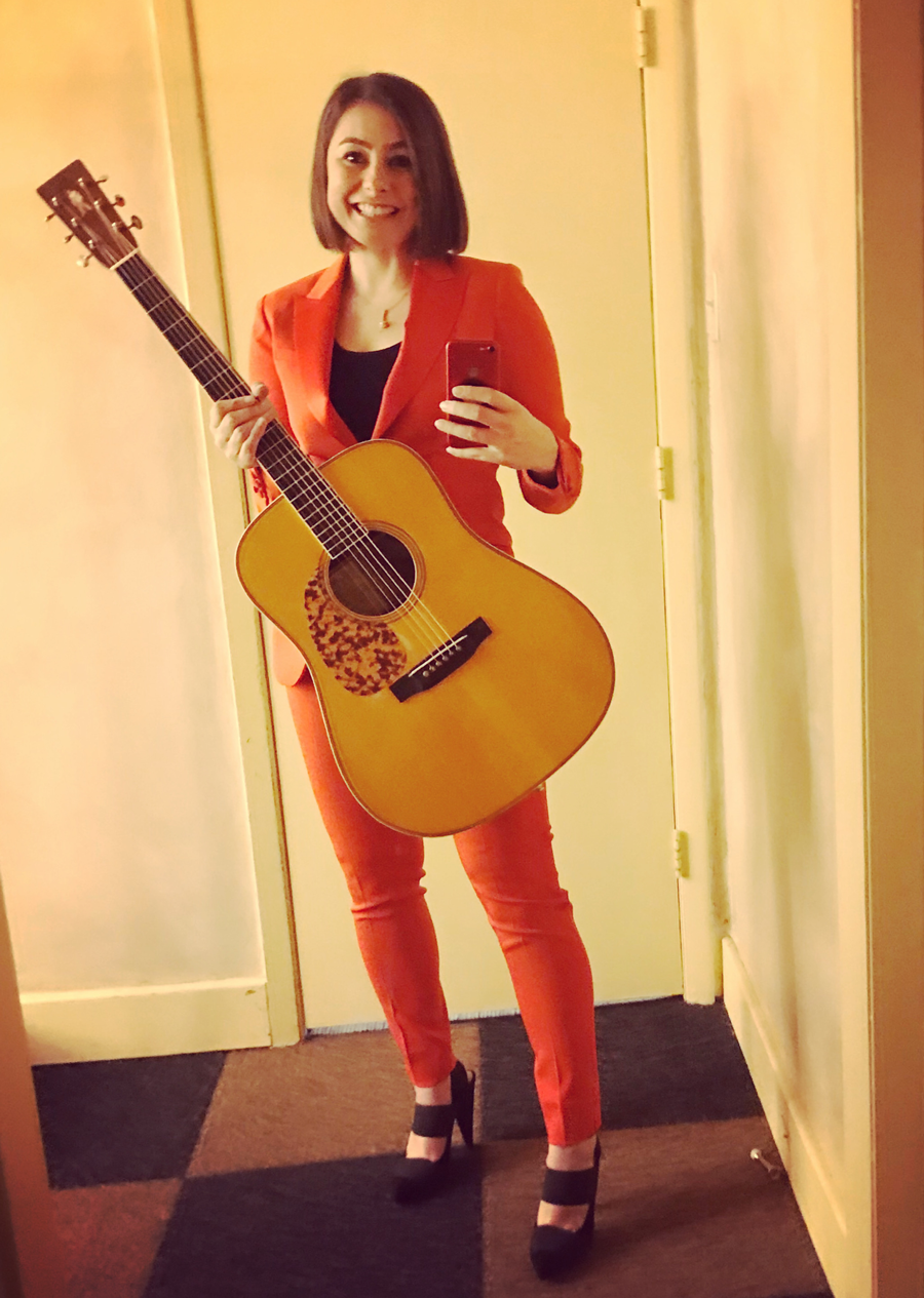 Sophia Johnson with her acoustic guitar